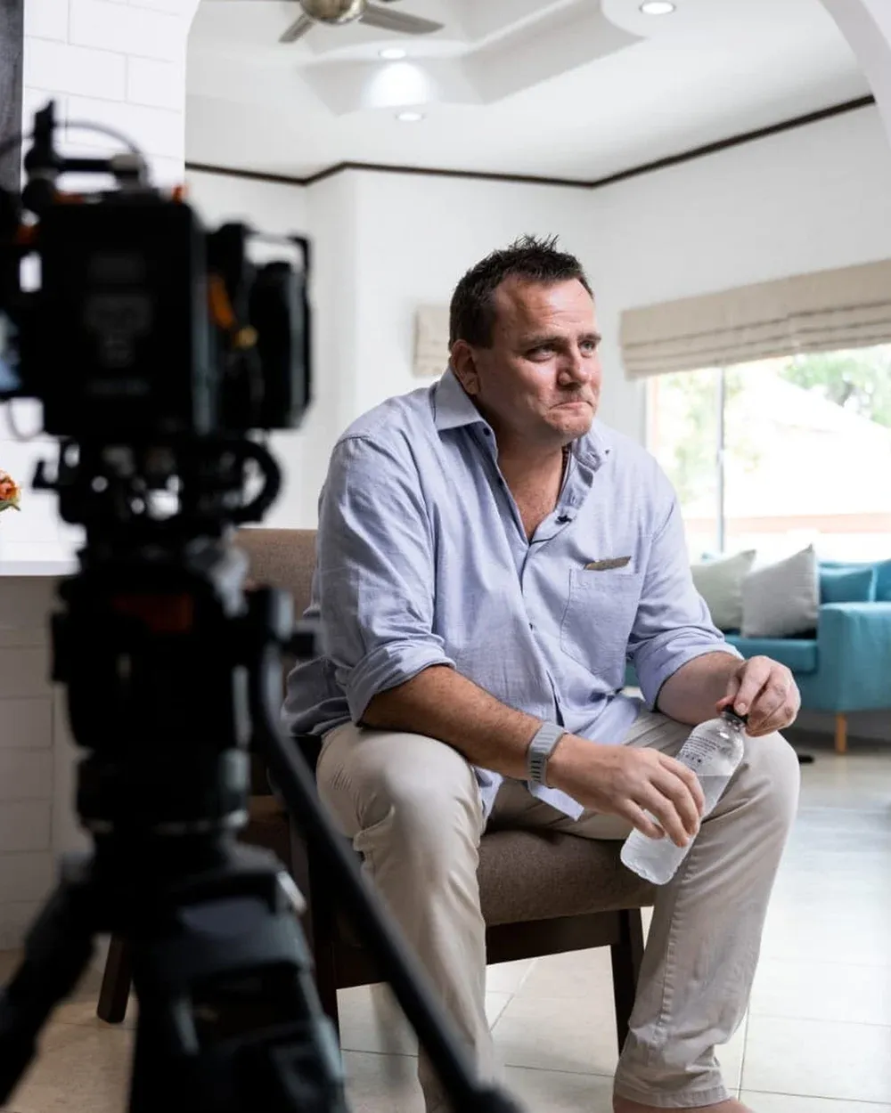 Craig Bilton seated during an interview